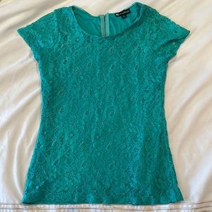Valerie Bertinelli lace teal top with gold zipper